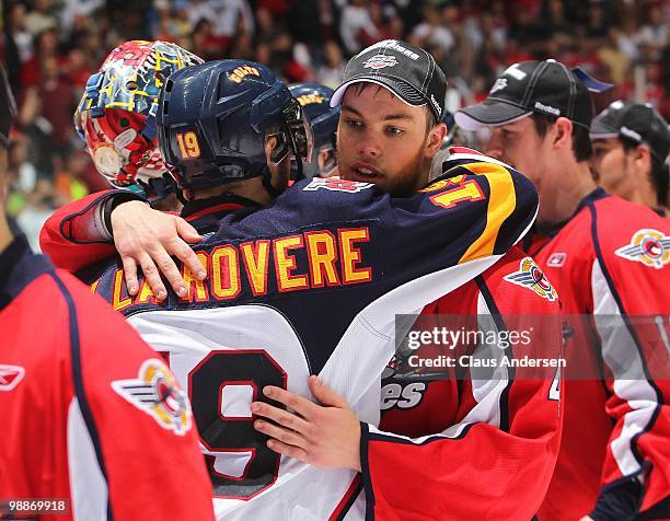 Taylor Hall of the Windsor Spitfires accepts congratulations from Stefan Della Rovere of the Barrie Colts after the 4th game of the OHL Championship...