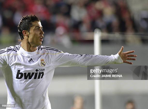 Real Madrid's Portuguese forward Cristiano Ronaldo celebrates after scoring against Mallorca during their Spanish League football match at the Ono...