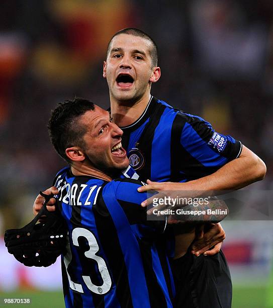 Marco Materazzi and Cristian Chivu of Inter celebrate victory after the Tim Cup match between FC Internazionale Milano and AS Roma at Stadio Olimpico...