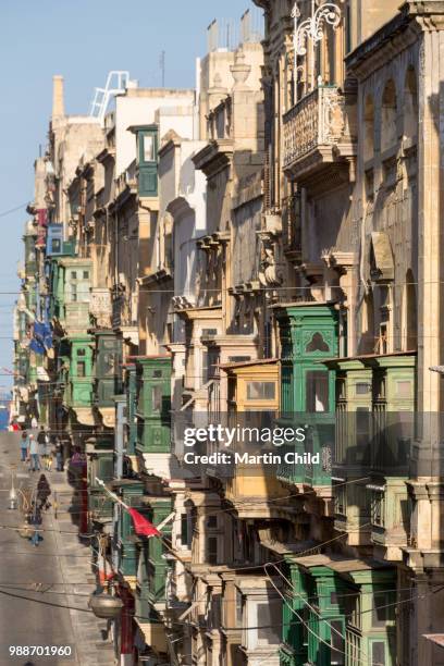 traditional balconies on the crowded triq ir repubblika street in old town valletta, unesco world heritage site and european capital of culture 2018, valletta, malta, mediterranean, europe - european capital of culture stock pictures, royalty-free photos & images