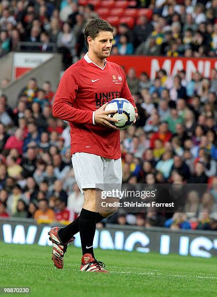 Keith Duffy plays football at United For Relief: The Big Red Family Day Out at Old Trafford on May 1, 2010 in Manchester, England.