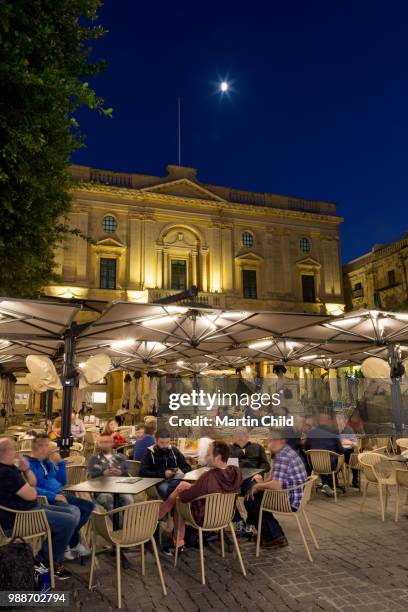 night time outdoor restaurants in piazza regina in valletta, european capital of culture 2018, malta, mediterranean, europe - european capital of culture stock pictures, royalty-free photos & images
