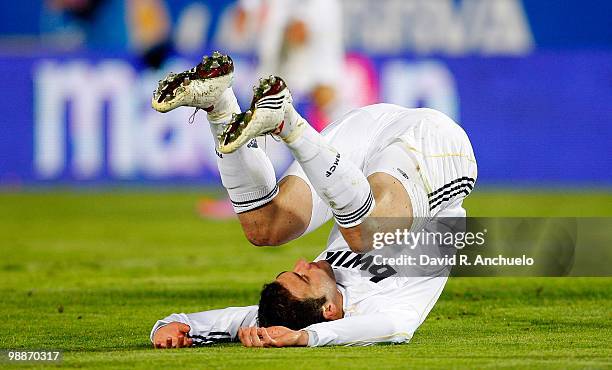 Gonzalo Higuain of Real Madrid rolls on the pitch during the La Liga match between Mallorca and Real Madrid at Ono Estadi on May 5, 2010 in Mallorca,...