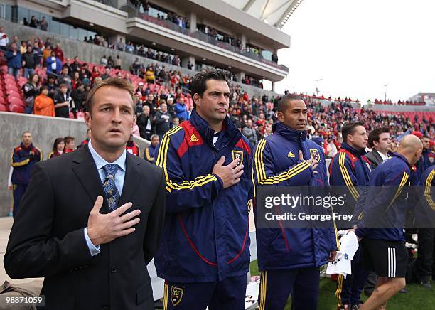 Real Salt Lake head coach Jason Kreis and team members stands for the national anthem before their game against Toronto FC at Rio Tinto Stadium on...