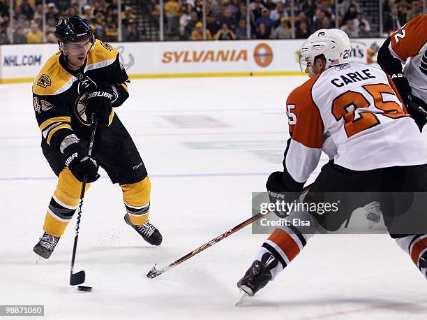 David Krejci of the Boston Bruins tries to get around Matt Carle of the Philadelphia Flyers in Game One of the Eastern Conference Semifinals during...