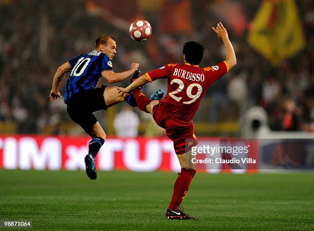 Wesley Sneijder of FC Inter Milan is injured during a tackle by Nicolas Burdisso of AS Roma during the Tim Cup final between FC Internazionale Milano...