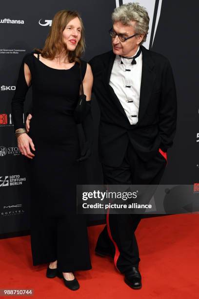 The film director Wim Wenders and his wife Donata Wenders arrive for the award ceremony of the 30th European Film Awards in Berlin, Germany, 9...