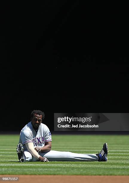 Vladimir Guerrero of the Texas Rangers warms up against the Oakland Athletics during an MLB game at the Oakland-Alameda County Coliseum on May 5,...