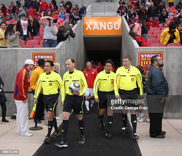 Game officials Nate Clement, Kevin Stott, Ramon Hernandez and Steven Taylor enter the field before the Toronto FC game against Real Salt Lake at Rio...