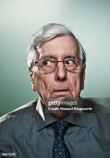 senior man, portrait - sospetto foto e immagini stock