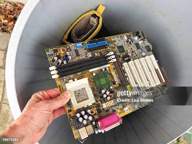 old computer motherboard into a garbage - lisa stokes stock pictures, royalty-free photos & images