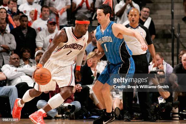 Stephen Jackson of the Charlotte Bobcats drives to the basket past J.J. Redick of the Orlando Magic in Game Four of the Eastern Conference...