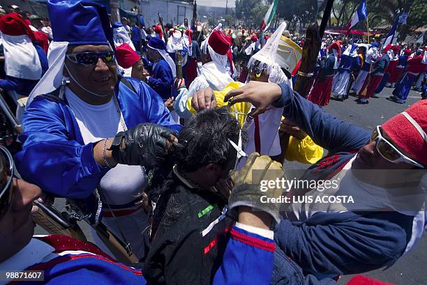 People rally along the streets of the Penon de los Banos neighbourhood in Mexico City, May 5 2010, commemorating Mexico's victory over France in the...