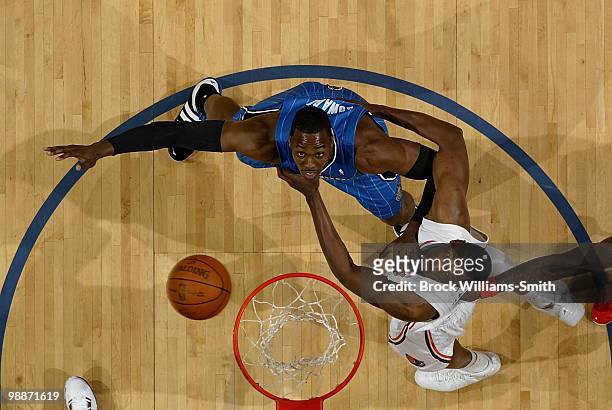 Dwight Howard of the Orlando Magic and Theo Ratliff of the Charlotte Bobcats look at the ball in Game Four of the Eastern Conference Quarterfinals...