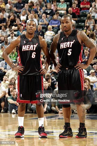 Mario Chalmers and Dwyane Wade of the Miami Heat stand on the court during the game against the Indiana Pacers at Conseco Fieldhouse on April 2, 2010...