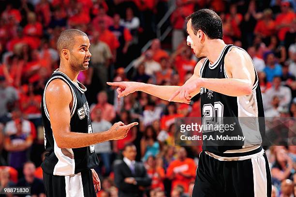 Tony Parker and Manu Ginobili of the San Antonio Spurs talks on the court in the game against the Phoenix Suns in Game One of the Western Conference...