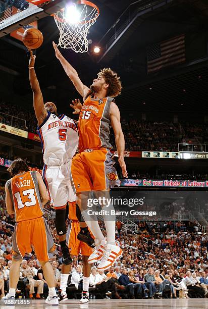 Bill Walker of the New York Knicks puts a shot up against Robin Lopez of the Phoenix Suns during the game at U.S. Airways Center on March 26, 2010 in...