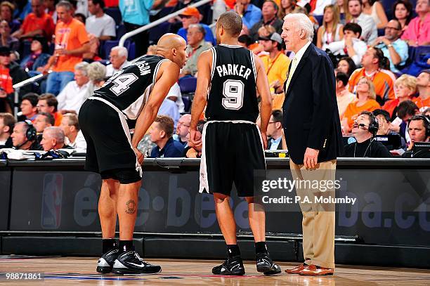 Richard Jefferson and Tony Parker talk to head coach Gregg Popovich of the San Antonio Spurs in Game One of the Western Conference Semifinals against...