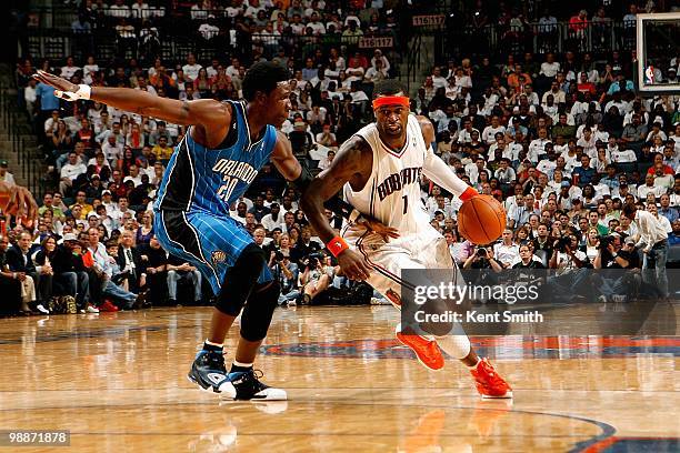 Stephen Jackson of the Charlotte Bobcats drives to the basket past Mickael Pietrus of the Orlando Magic in Game Four of the Eastern Conference...