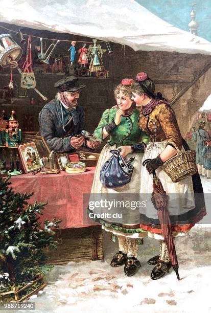 zwei junge frauen auf der suche nach geschenken auf dem weihnachtsmarkt - weihnachtsmarkt stock-grafiken, -clipart, -cartoons und -symbole