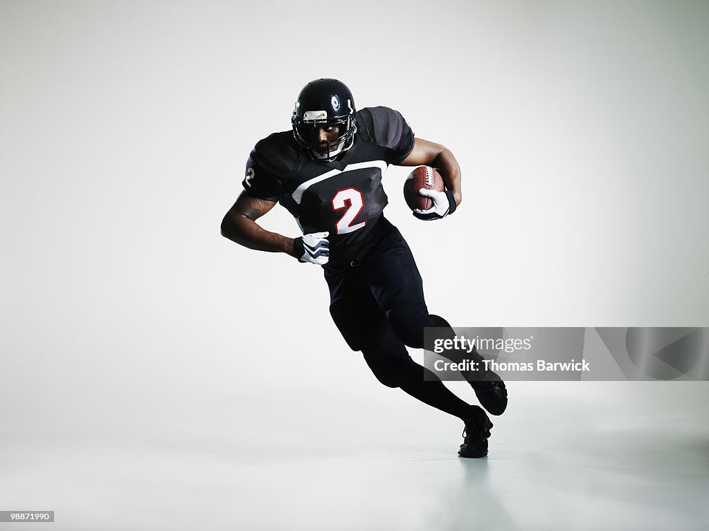 Football player running with ball