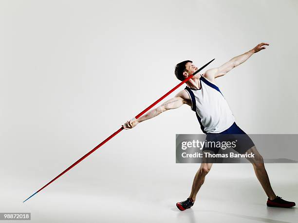male track athlete preparing to throw javelin - track and field event 個照片及圖片檔