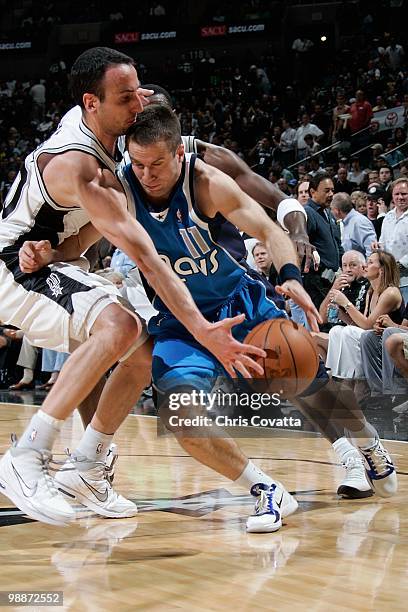 Jose Barea of the Dallas Mavericks drives against Manu Ginobili of the San Antonio Spurs in Game Three of the Western Conference Quarterfinals during...