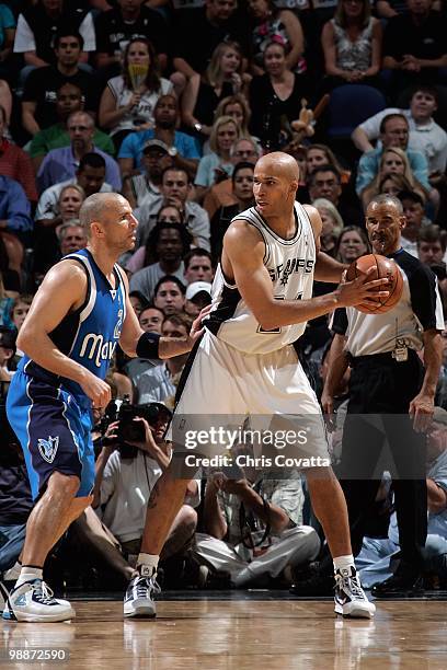 Richard Jefferson of the San Antonio Spurs handles the ball against Jason Kidd of the Dallas Mavericks in Game Three of the Western Conference...