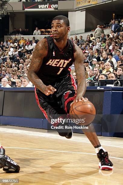 Dorell Wright of the Miami Heat dribbles the ball downcourt against the Indiana Pacers during the game at Conseco Fieldhouse on April 2, 2010 in...