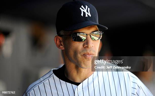 Joe Girardi of the New York Yankees walks in the dugout against the Baltimore Orioles at Yankee Stadium on May 5, 2010 in the Bronx borough of New...