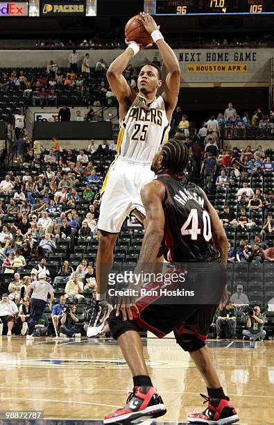 Brandon Rush of the Indiana Pacers makes a jumpshot against Udonis Haslem of the Miami Heat during the game at Conseco Fieldhouse on April 2, 2010 in...