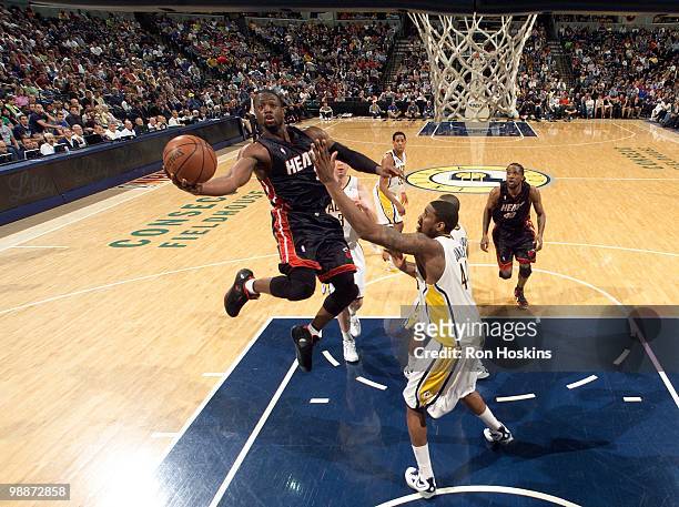 Dwyane Wade of the Miami Heat puts a shot up against Solomon Jones of the Indiana Pacers during the game at Conseco Fieldhouse on April 2, 2010 in...