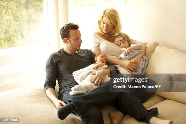 Actress Jenna Elfman and husband Bodhi Elfman pose with their daughter Story Elfman and new son Easton Elfman during a photo shoot on March 24, 2010...