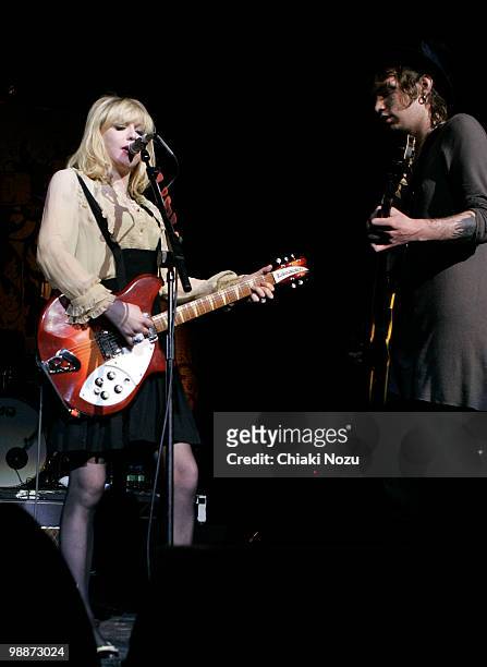Courtney Love and Micko Larkin of Hole perform at Brixton Academy on May 5, 2010 in London, England.