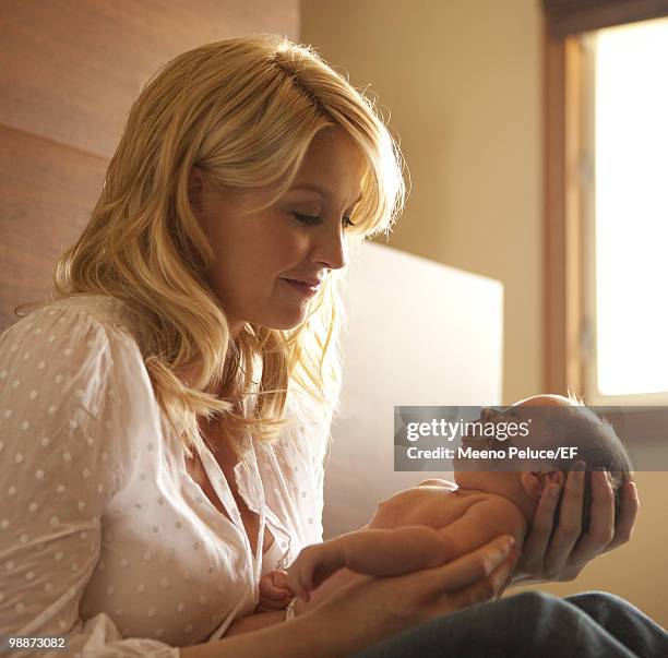 Actress Jenna Elfman poses with her new son Easton Elfman during a photo shoot on March 24, 2010 in Los Angeles, California.