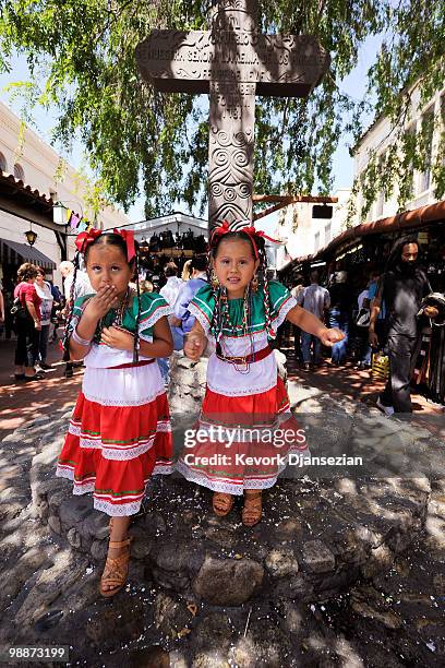 Four year old twins Jazmin and Sarah Chavez from San Bernardino, California attend Cinco de Mayo festivities on May 5 at El Pueblo de Los Angeles...