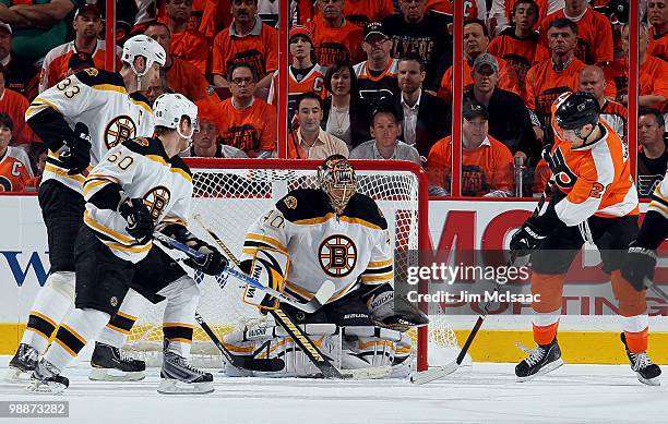 James van Riemsdyk of the Philadelphia Flyers is stopped by Tuukka Rask of the Boston Bruins as Zdeno Chara and Vladimir Sobotka defend in Game Three...