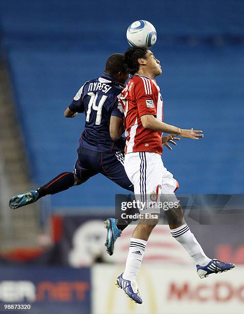 Sainey Nyassi of the New England Revolution and Jesus Padilla of Chivas USA fight for the ball on May 5, 2010 at Gillette Stadium in Foxboro,...