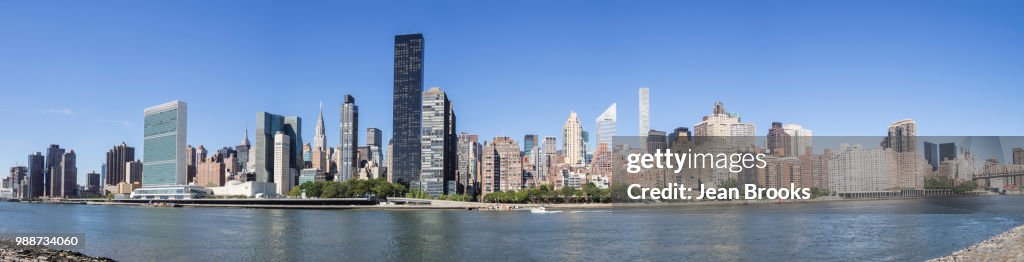 Panoramic skyline of Manhattan including UN, Empire State Building and Matchstick Building from Roosevelt Island, New York, United States of America, North America