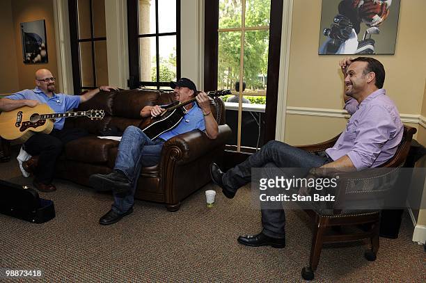 Recording artist Tim McGraw, with fellow band members relax before performing at the Military Appreciation Ceremony prior to the start of THE PLAYERS...