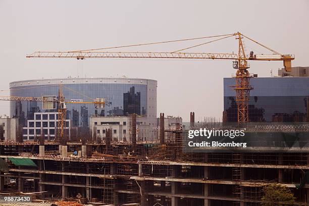 New corporate buildings sit under construction in the Bandra Kurla Complex of Mumbai, India, on Friday, April 30, 2010. UBS AG and JPMorgan Chase &...