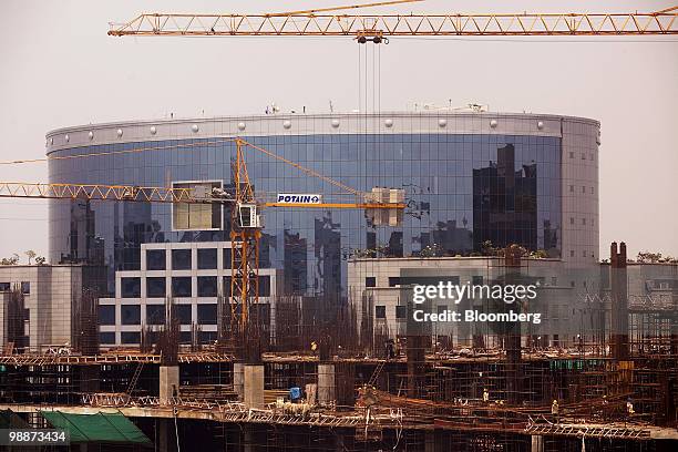 New corporate buildings sit under construction in the Bandra Kurla Complex of Mumbai, India, on Friday, April 30, 2010. UBS AG and JPMorgan Chase &...