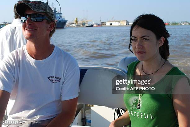 Charter boat captain William Bradford and National Wildlife Federation ambassador and race car driver Leilani Munter return to port after viewing...
