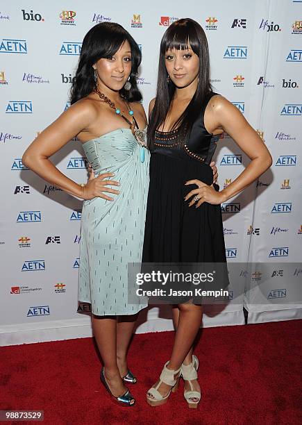 Personalities Tamera Mowry and Tia Mowry attend the 2010 A&E Upfront at the IAC Building on May 5, 2010 in New York City.