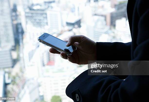 businessman using pda,close up - newbusiness fotografías e imágenes de stock