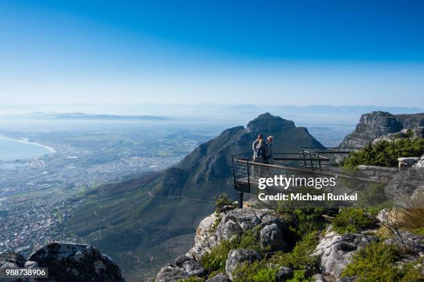 family enjoying the view from table mountain over cape town, south africa, africa - floating moored platform stock pictures, royalty-free photos & images