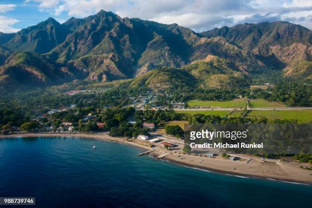 aerial of the costal exclave oecusse (oecussi), east timor, southeast asia, asia - costal stock pictures, royalty-free photos & images
