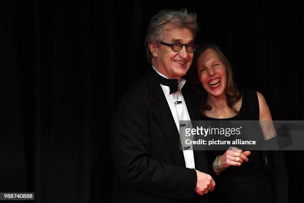 The film director Wim Wenders and his wife Donata Wenders arrive for the award ceremony of the 30th European Film Awards in Berlin, Germany, 9...