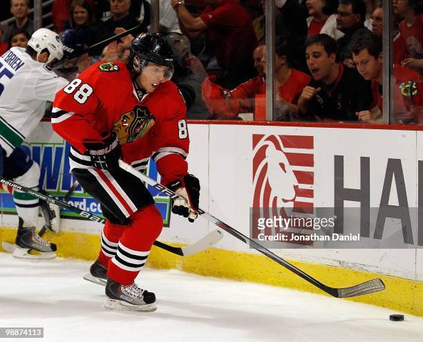 Patrick Kane of the Chicago Blackhawks controls the puck in the corner against the Vancouver Canucks in Game Two of the Western Conference Semifinals...