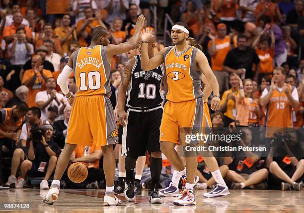 Jared Dudley of the Phoenix Suns high-fives teammate Leandro Barbosa after scoring against the San Antonio Spurs during Game Two of the Western...